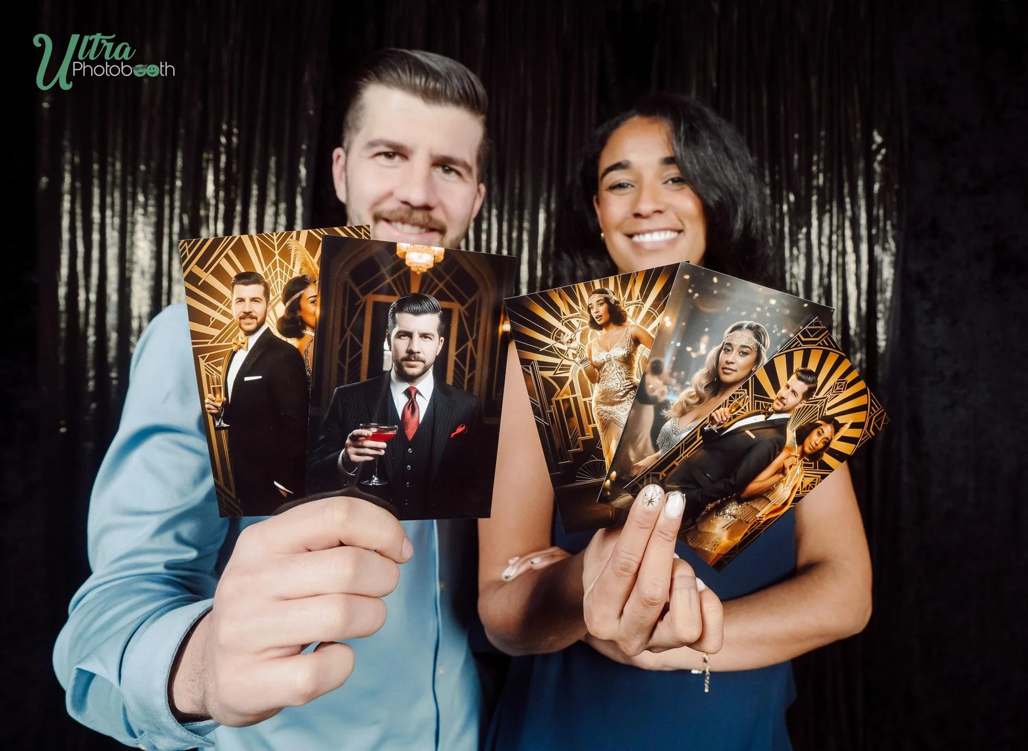 Two guests showing their gold art-deco AI portrait prints against a dark backdrop