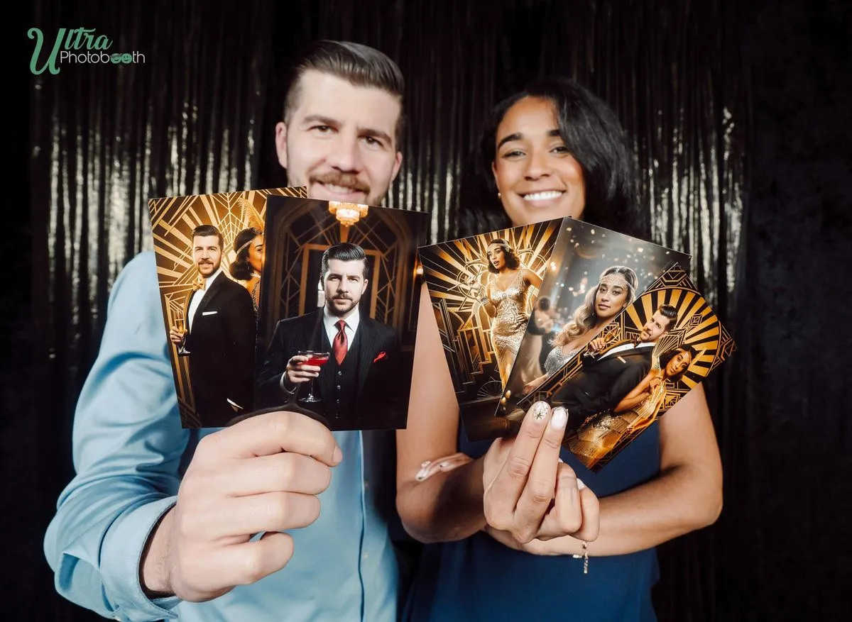 Two guests showing their gold art-deco AI portrait prints against a dark backdrop
