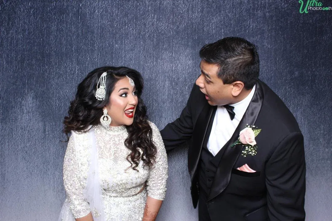 Happy guests using the Traditional DSLR Photo Booth at an event - Image 13